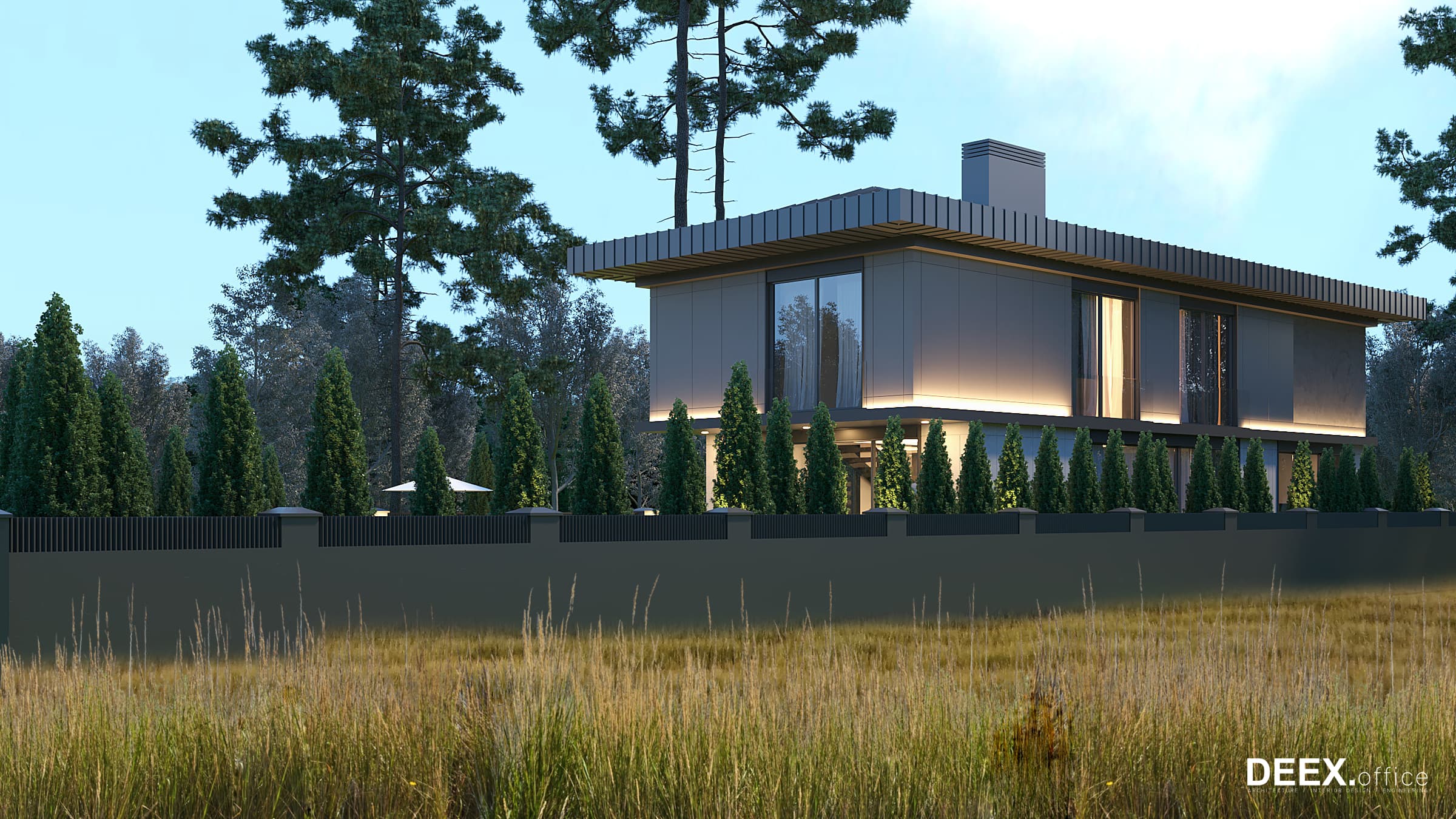 Side view of residence with clean white panels and evergreen hedge row