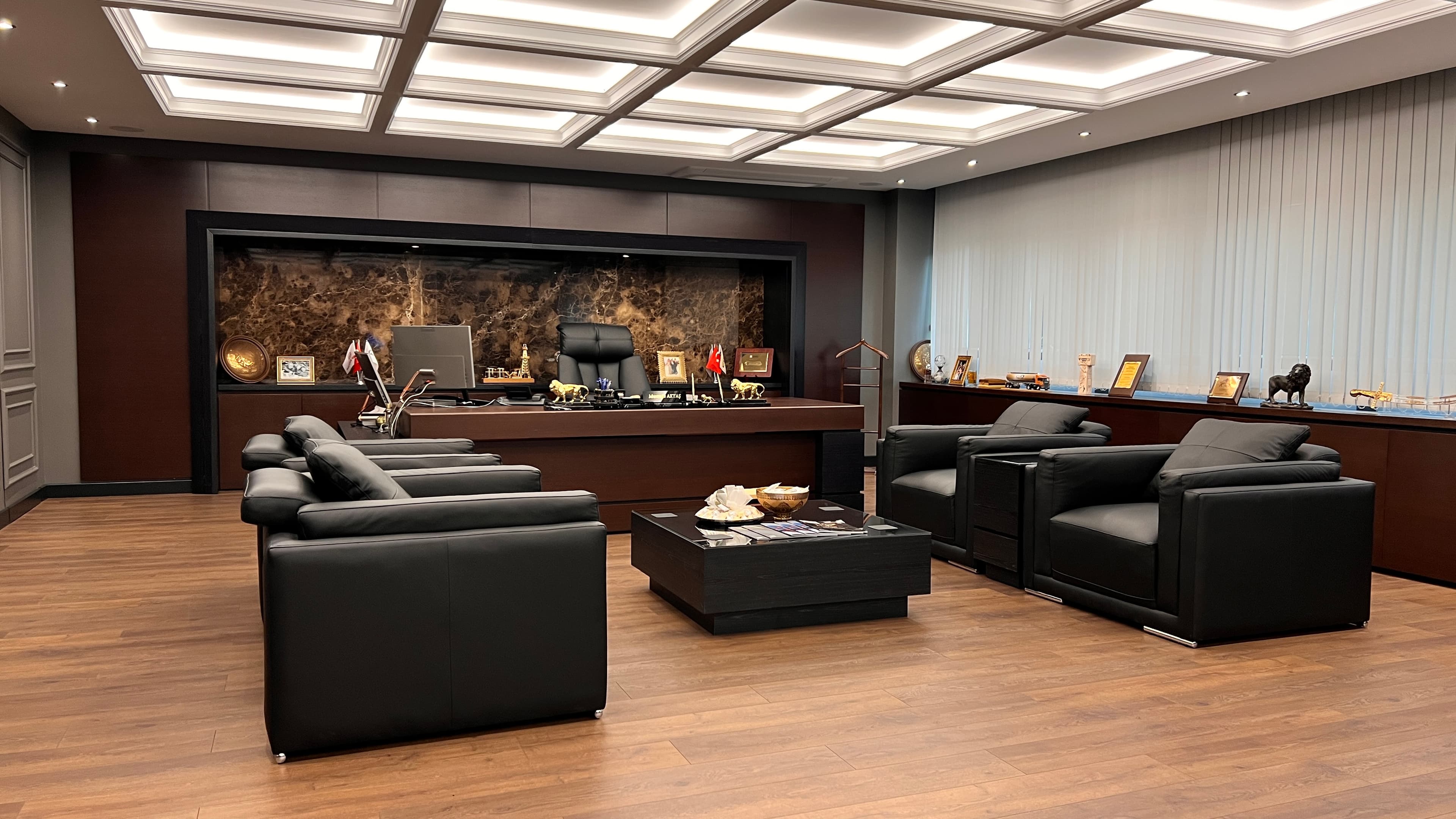 Real photo of seating area facing the executive desk