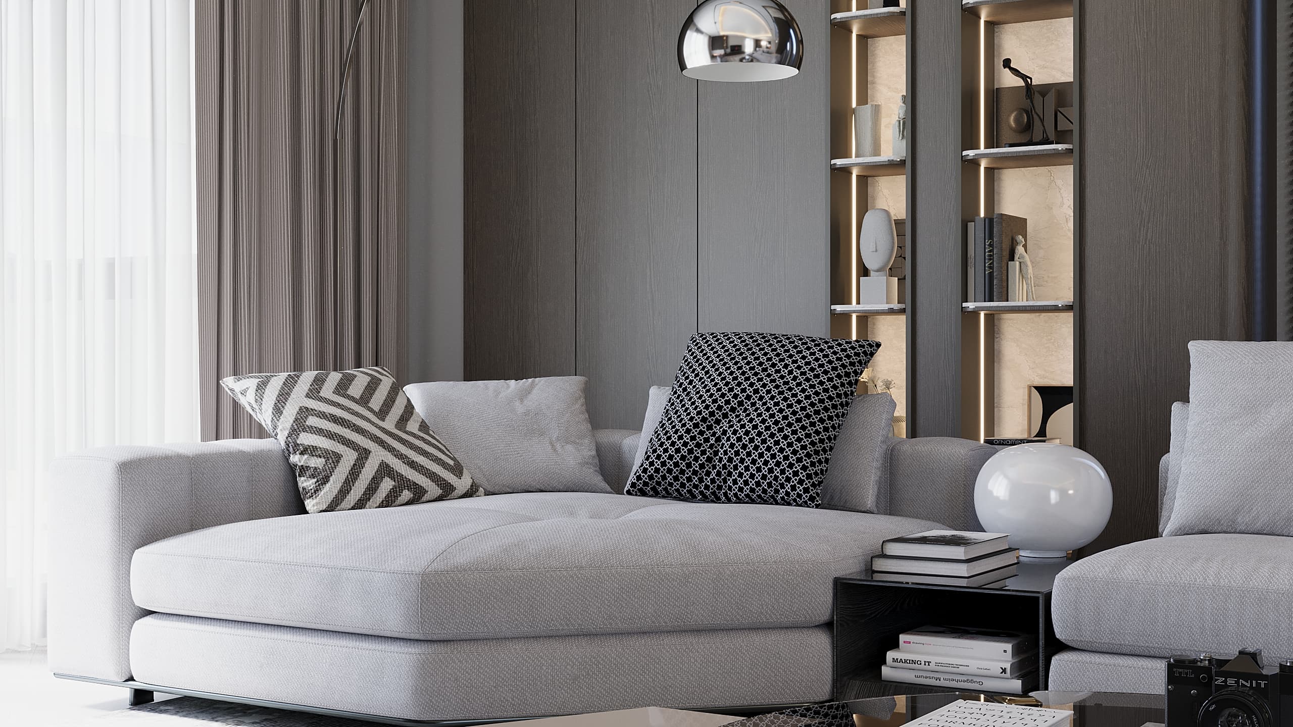 Grey sofa with patterned cushions beside built-in bookshelf