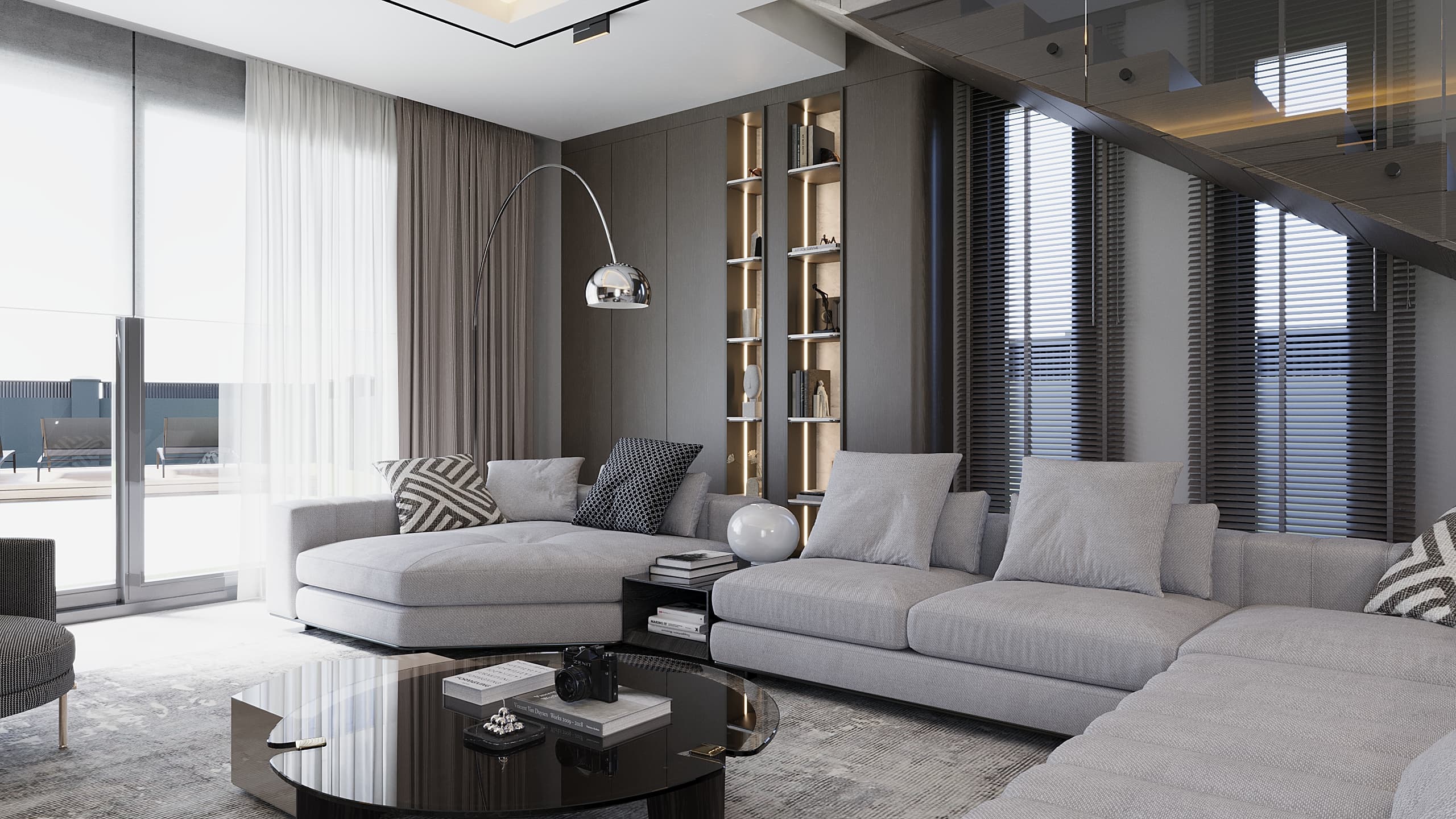 Full living room with L-shaped sofa, bookshelf and staircase